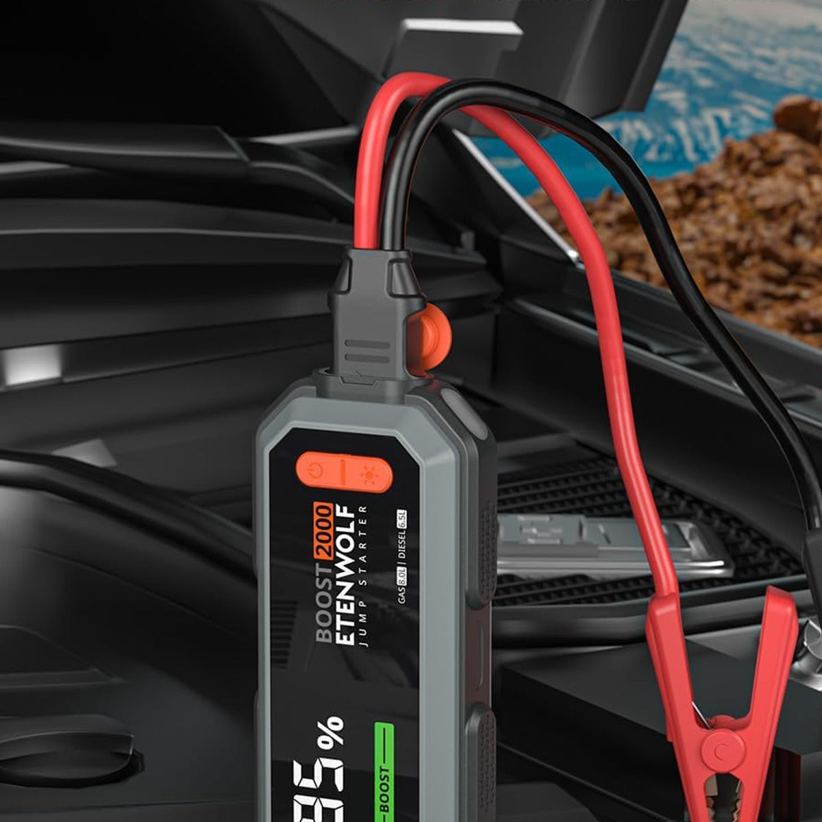 J1 jump starter connected to a vehicle battery